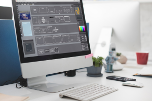 A desktop computer displaying a design software interface on the screen.